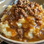 Creamy Mashed Potatoes with Rich, Slow-Simmered Beef Gravy
