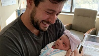 My Husband Froze When He Saw Our Newborn Daughter — Then He Pointed Behind Her Ear and Told Me the Truth